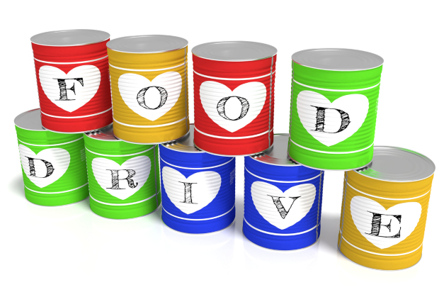 Nine stacked tin cans in different colors each with a letter of the words food drive